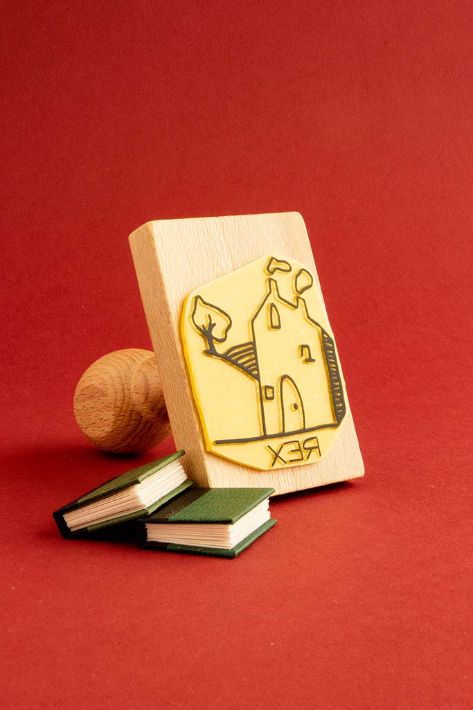 Sello exlibris grabado con un una casa de campo